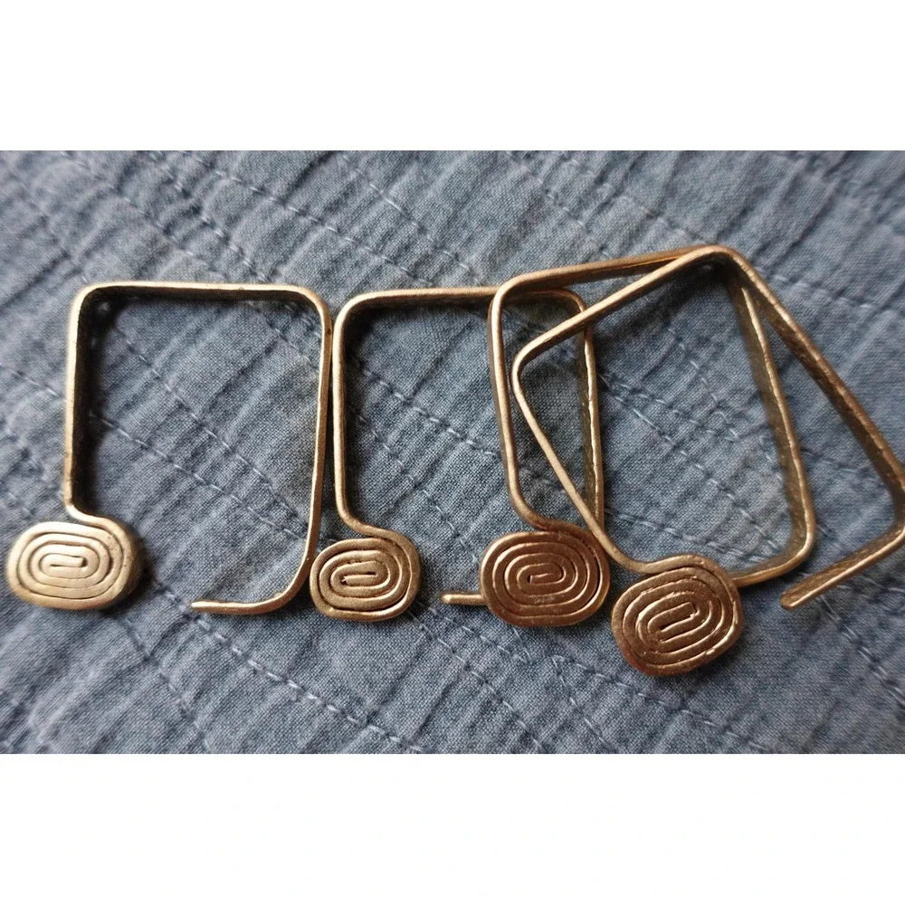 set of 4 Vintage napkin rings metal brass with swirl rectangular‎ design